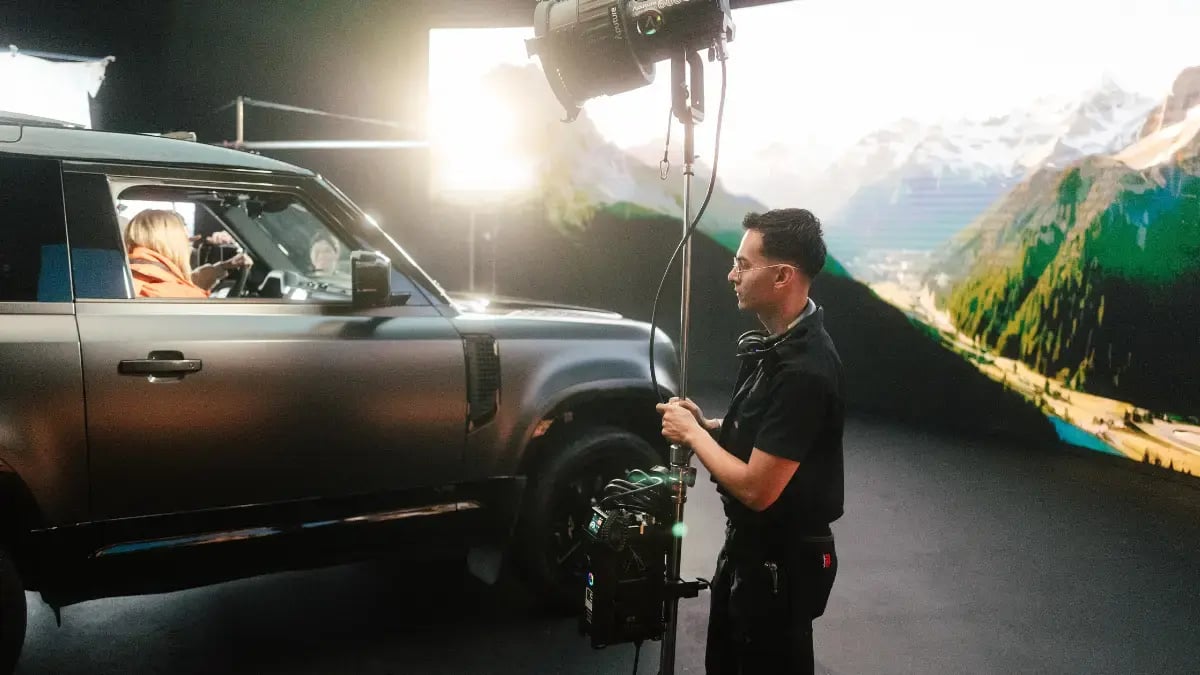 a gaffer lights a vehicle on an LED virtual stage