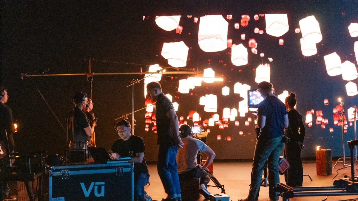 a video production crew collaborates in an LED volume