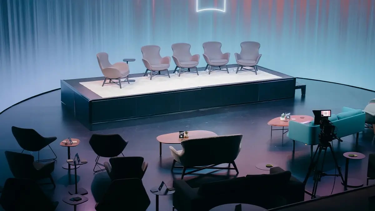 A stage is set up for a panel discussion