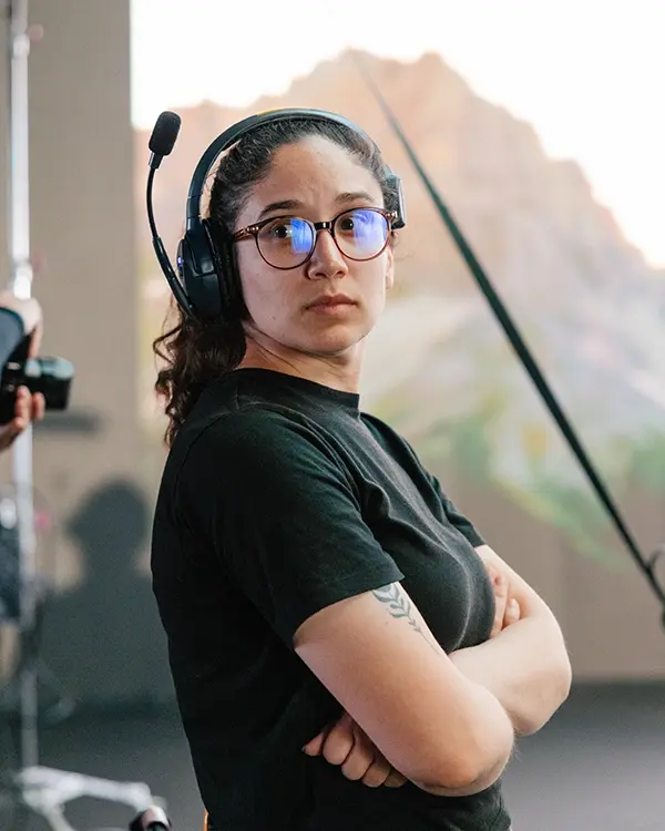 a gaffer stands at attention on a virtual production set