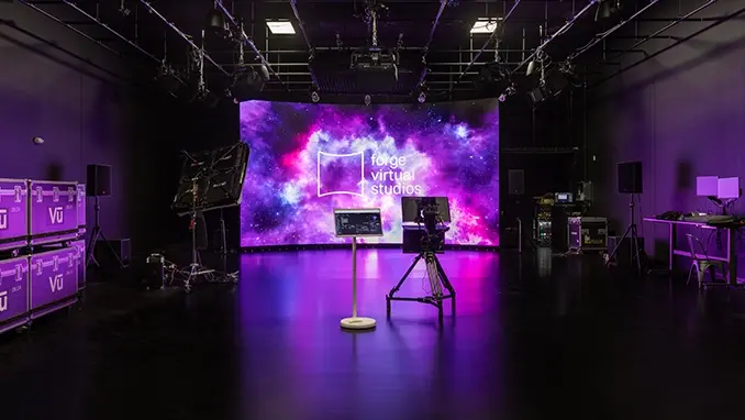 A Virtual Production stage with RED cinema camera and touch screen control tablet
