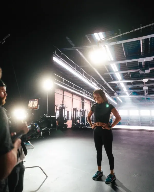 An actor being filmed by a cinematographger on a virtual production stage